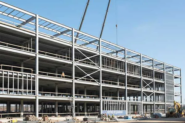 Caribbean and Central America multi-storey steel structure building project with steel columns, floor beams, bracing systems, and on-site frame installation.