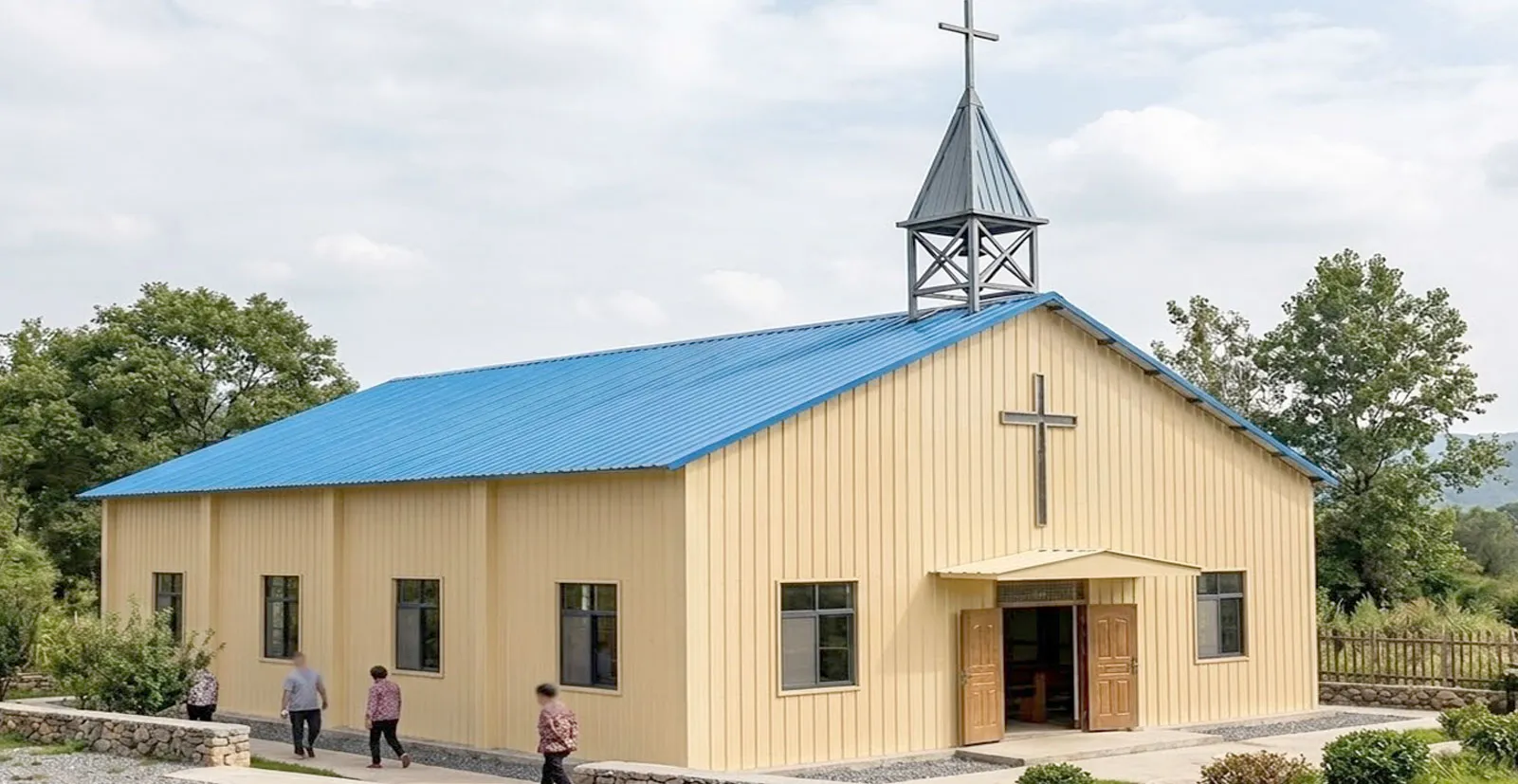 Church building with blue metal roof, vertical wall panels, front entrance canopy, cross on façade, and cross-topped tower for rural worship projects.