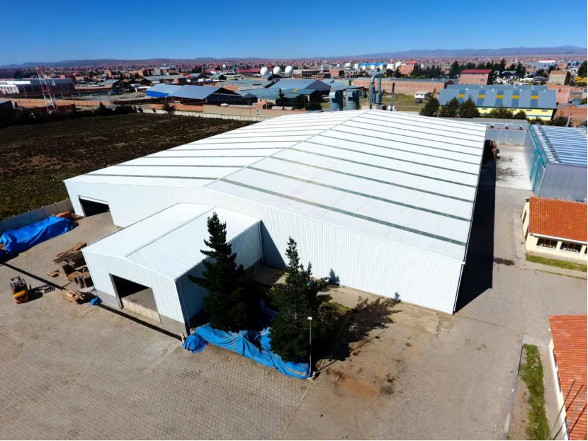 Aerial view of the completed 4,320 m² Bolivia steel warehouse with roof daylighting panels and metal cladding.