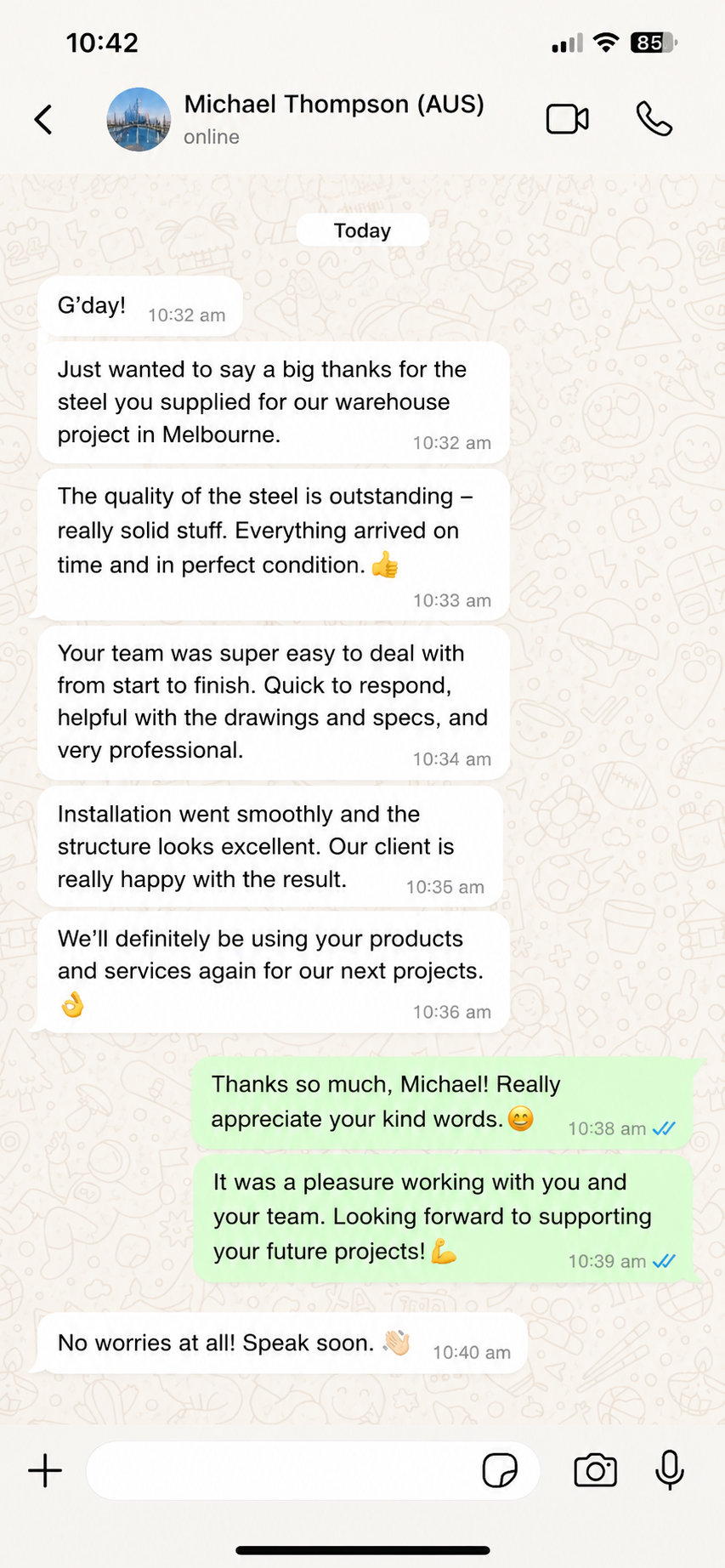 WhatsApp review from Australia praising a steel structure warehouse building, timely delivery, and installation support.
