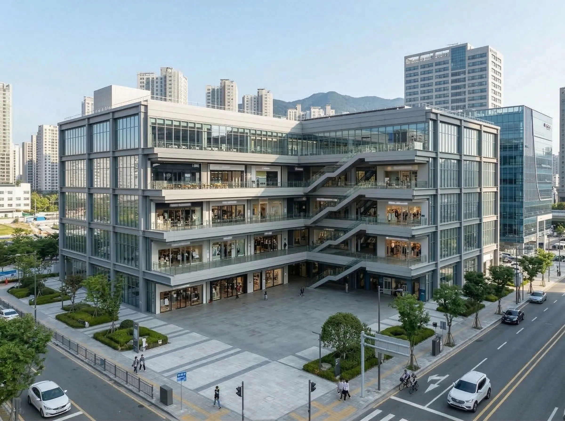 Shopping mall exterior with glass facade, open retail floors, and street access for commercial projects