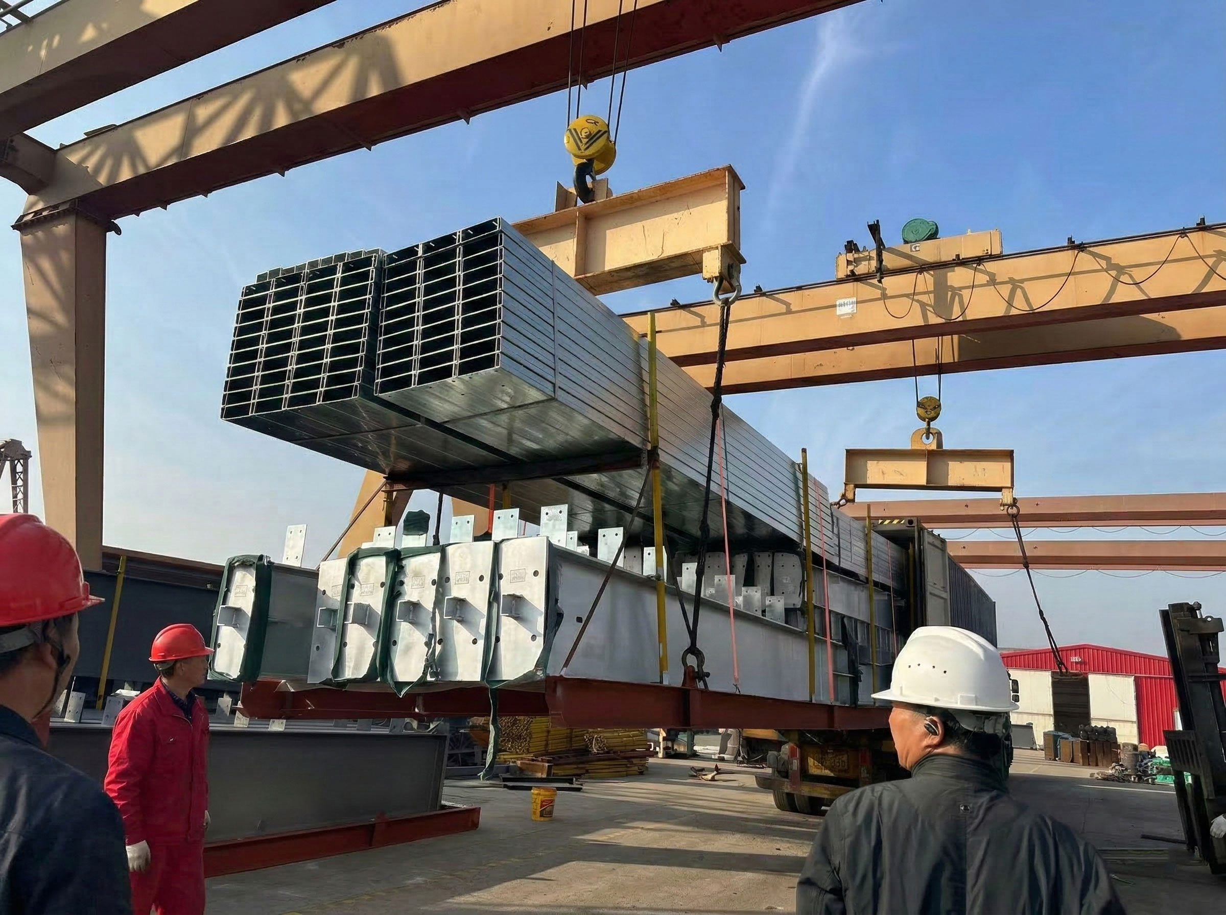 Steel structure cow shed components being lifted by gantry crane for export loading, including galvanized steel tubes and prefabricated parts for livestock building projects.