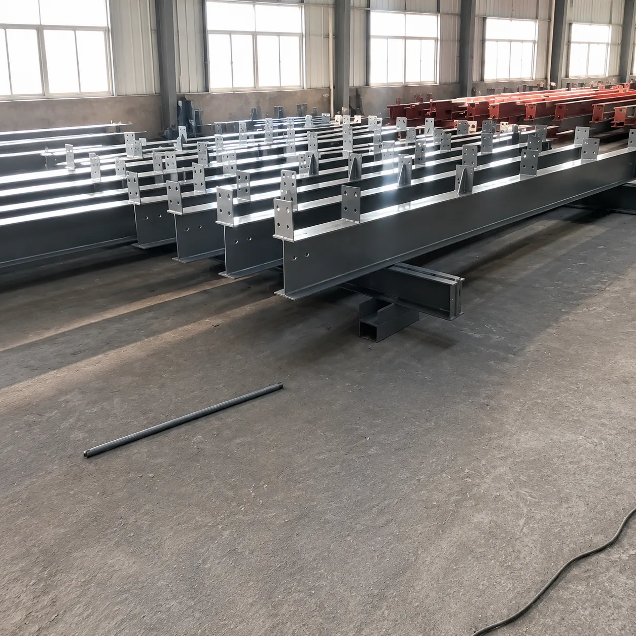 Welded H-section structural steel beams fabricated for the 4,320 m² Bolivia warehouse project.