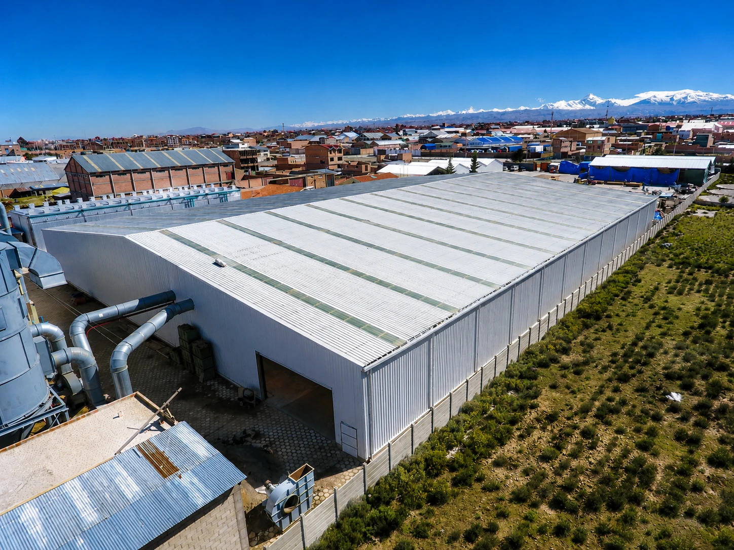 Aerial view of the completed Bolivia steel warehouse with metal cladding and roof daylighting panels.