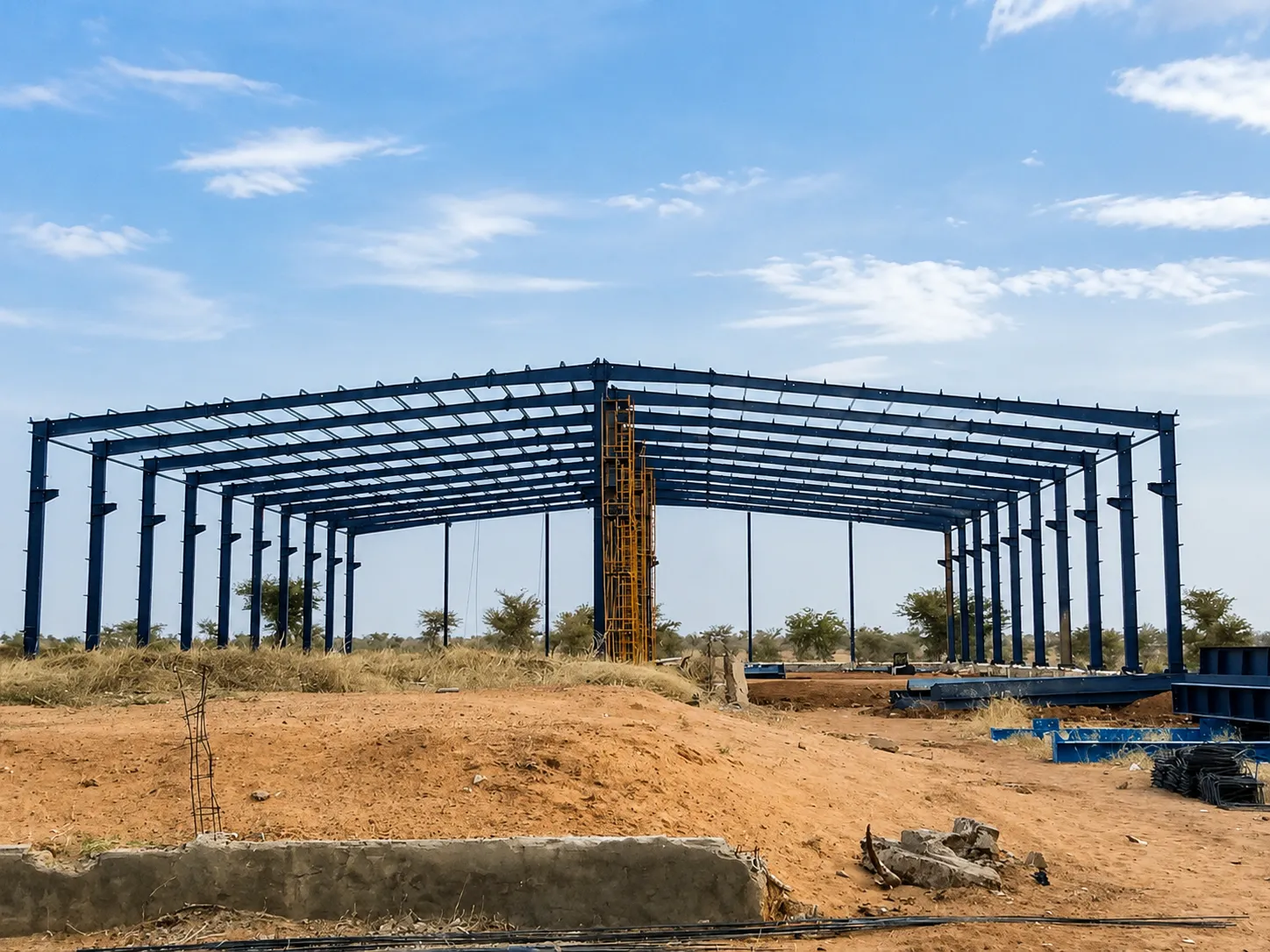 Steel frame structure installation for Niger warehouse project with portal frame beams and columns