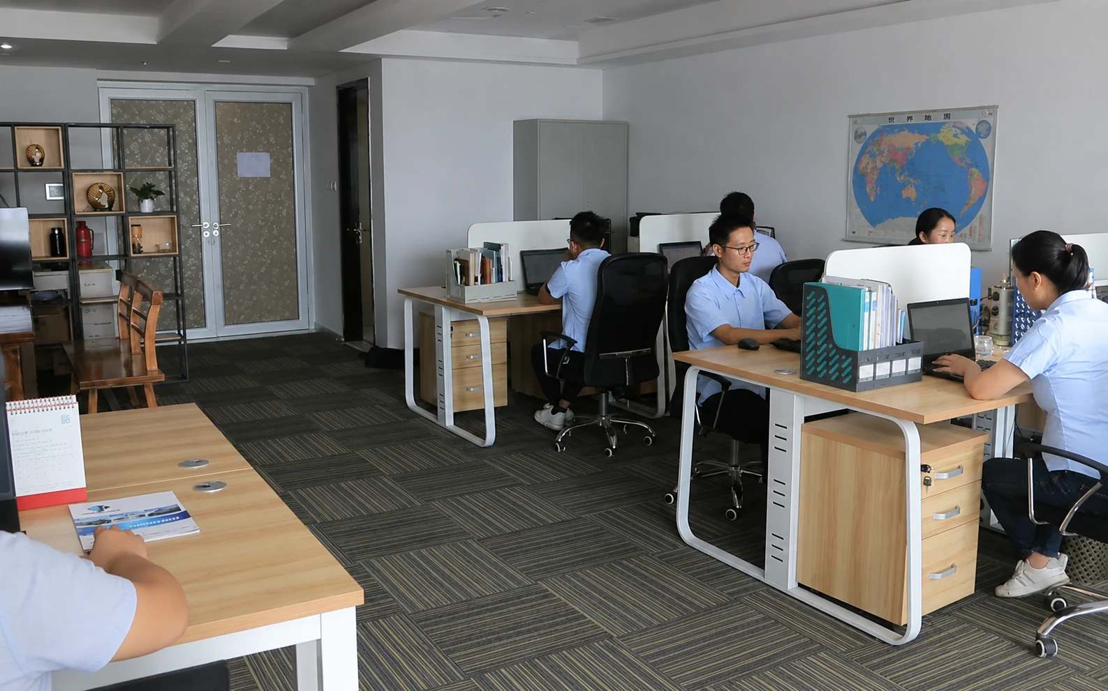 Engineering and detailing team working on steel structure design, drawings and project documentation in the technical office.