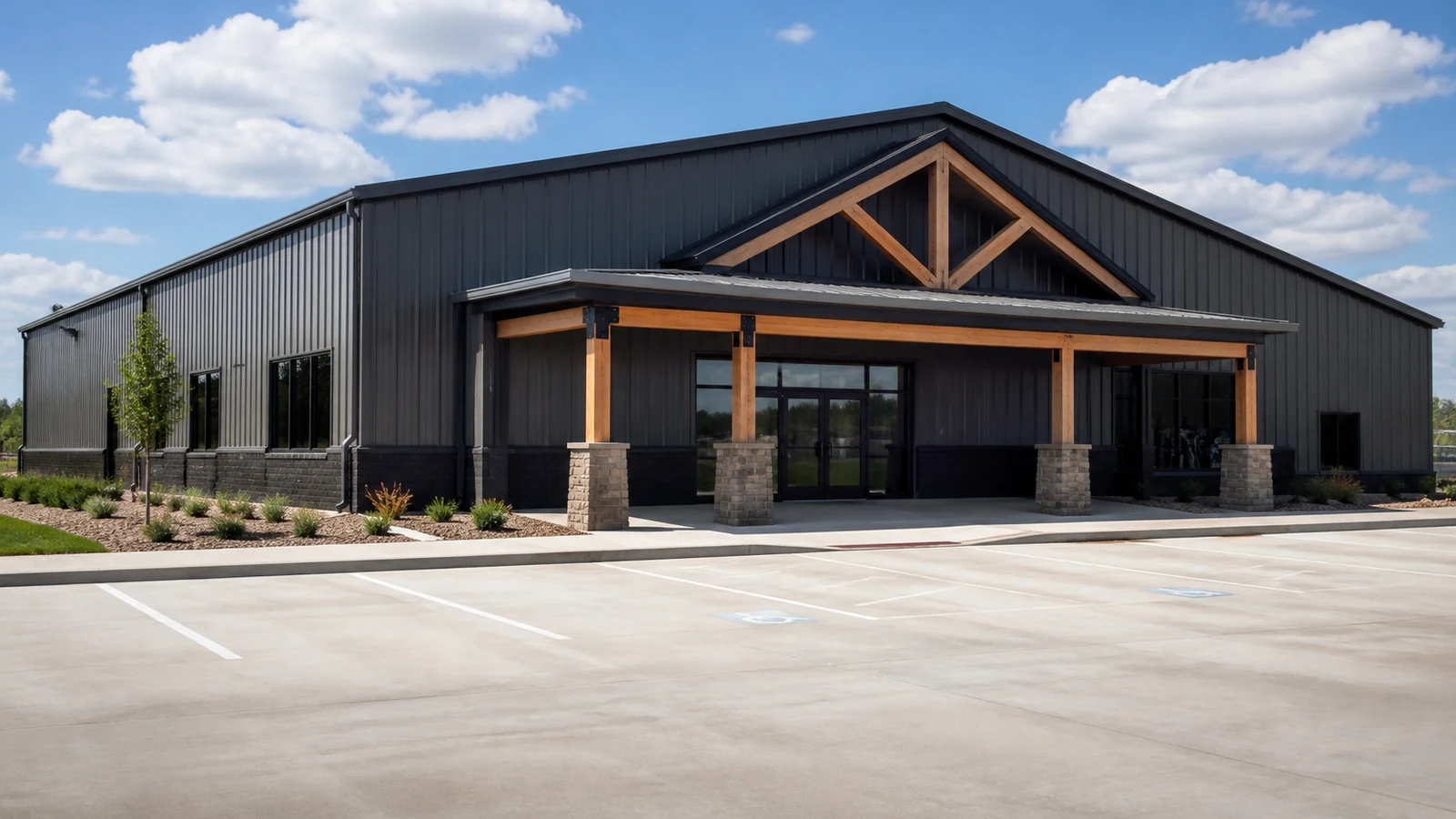 Completed clear-span steel gym building with practical entrances and service access.